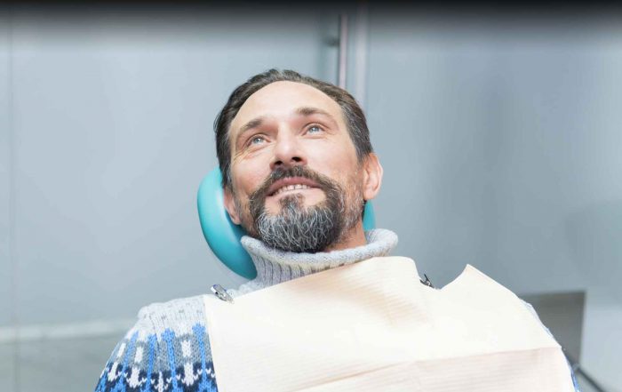 person in a dental chair for ozone therapy